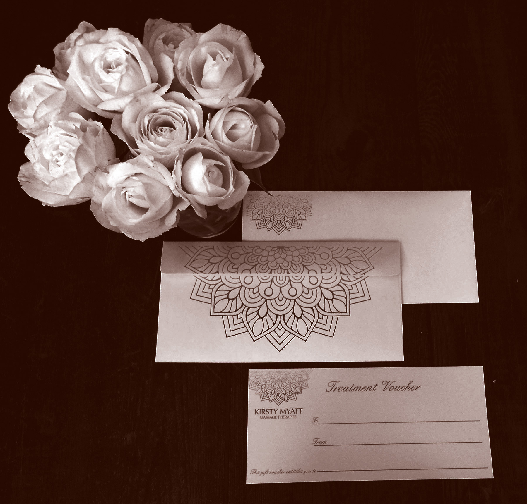 Kirsty Myatt Massage Therapies gift voucher with white roses